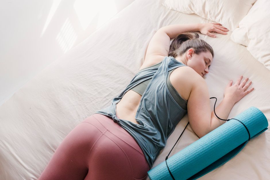 A quiet restorative yoga posture in soft light.